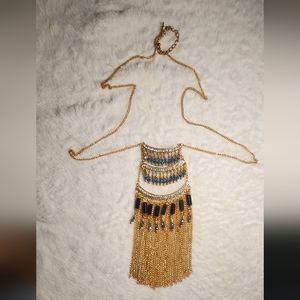 Decoration, long pendant, gilded with black and white stones.